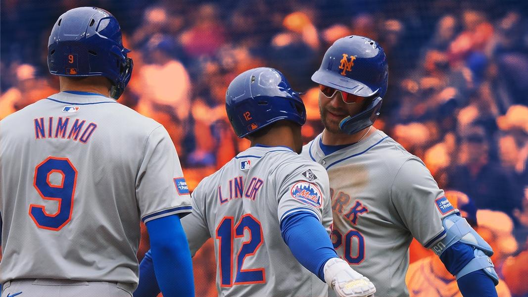 Pete Alonso and Francisco Lindor celebrate with a chest bump with Brandon Nimmo in the foreground / USA TODAY Sports/SNY Treated Image