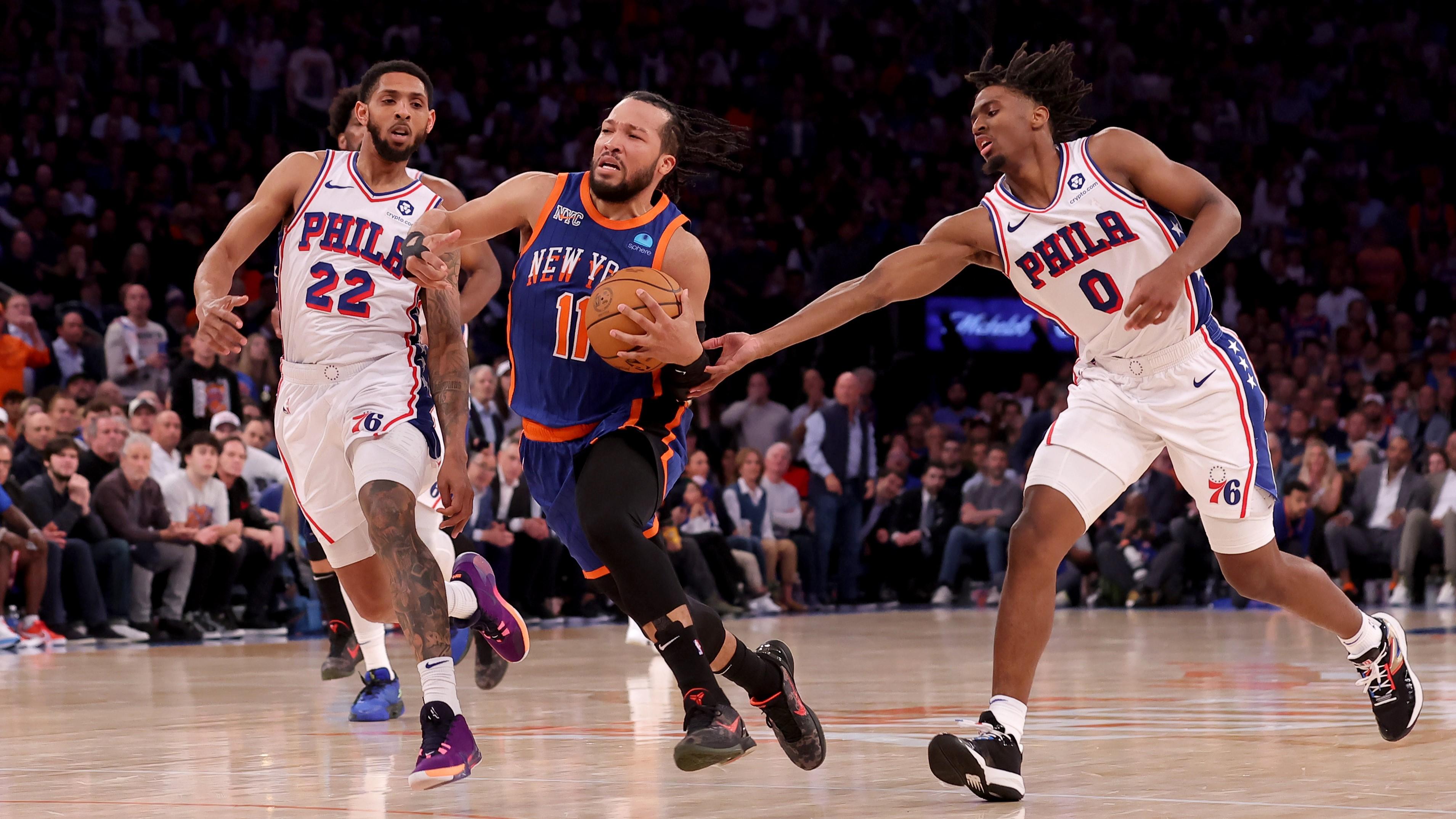 Apr 30, 2024; New York, New York, USA; New York Knicks guard Jalen Brunson (11) drives to the basket against Philadelphia 76ers guards Cameron Payne (22) and Tyrese Maxey (0) during the fourth quarter of game 5 of the first round of the 2024 NBA playoffs at Madison Square Garden. Mandatory Credit: Brad Penner-USA TODAY Sports / © Brad Penner-USA TODAY Sports