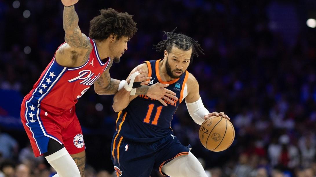 Apr 28, 2024; Philadelphia, Pennsylvania, USA; New York Knicks guard Jalen Brunson (11) drives against Philadelphia 76ers guard Kelly Oubre Jr. (9) during the second half of game four of the first round in the 2024 NBA playoffs at Wells Fargo Center. / Bill Streicher-USA TODAY Sports