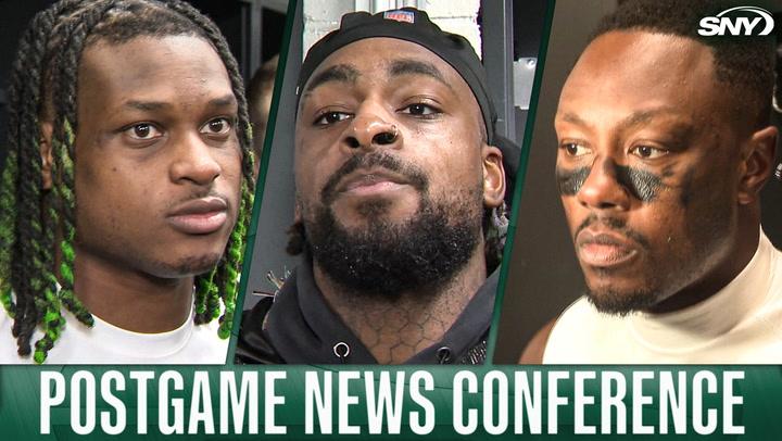 Three New York Jets players at postgame news conference with SNY logo.