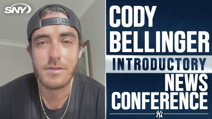 Cody Bellinger excited to join Yankees, open to multiple positions; featured at news conference.