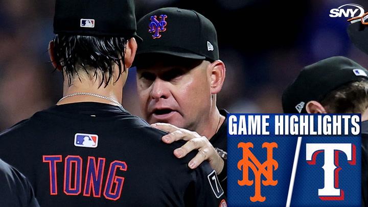 Mets coach talking to player.