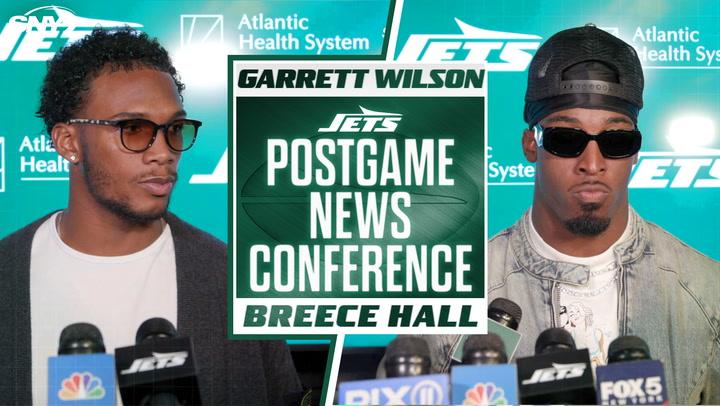 Garrett Wilson and Breece Hall discuss Jets' late-game struggles at a postgame conference.