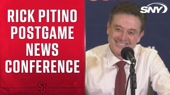 Rick Pitino smiling at a postgame conference after St. John's beats UConn 68-62.