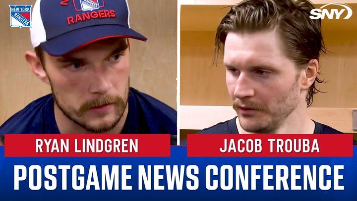 Ryan Lindgren and Jacob Trouba at a postgame conference, discussing the Rangers' 4-3 loss.