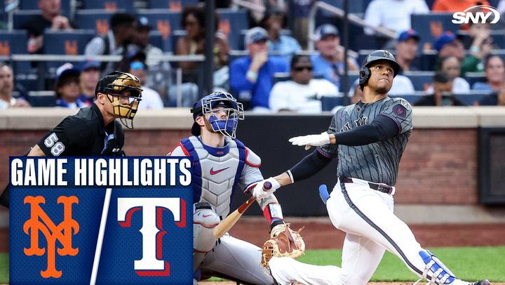 Batter swings as catcher watches.