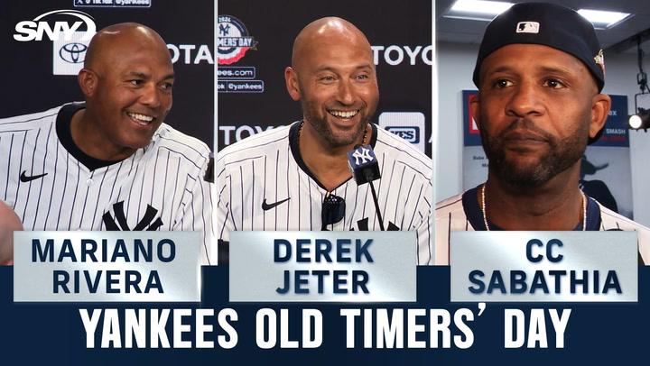 Mariano Rivera, Derek Jeter, and CC Sabathia celebrate the 2009 championship team at Old Timers' Day.