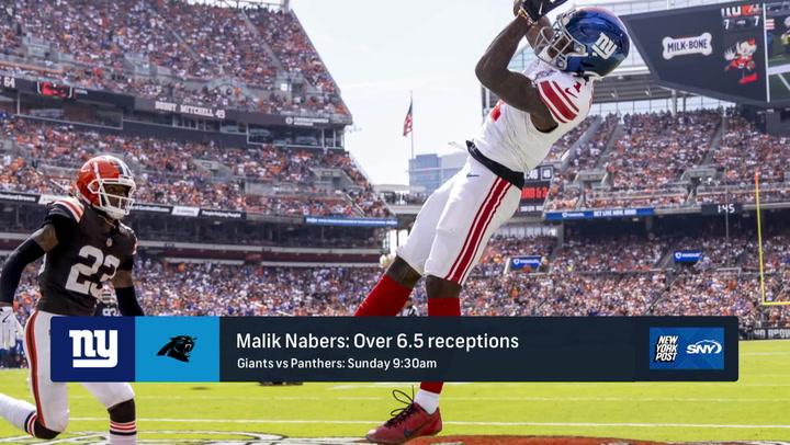 NFL Week 10 action featuring Malik Nabers catching a pass. Prop bet: Over 6.5 receptions.