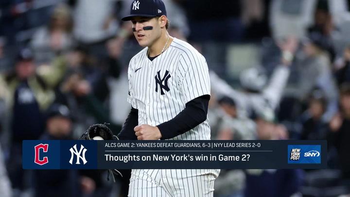 A Yankees player celebrates a win against the Guardians in 2024 ALCS Game 2, leading 2-0.