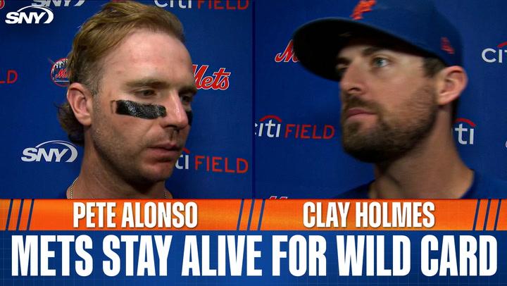 Pete Alonso and Clay Holmes with text "Mets stay alive for wild card"