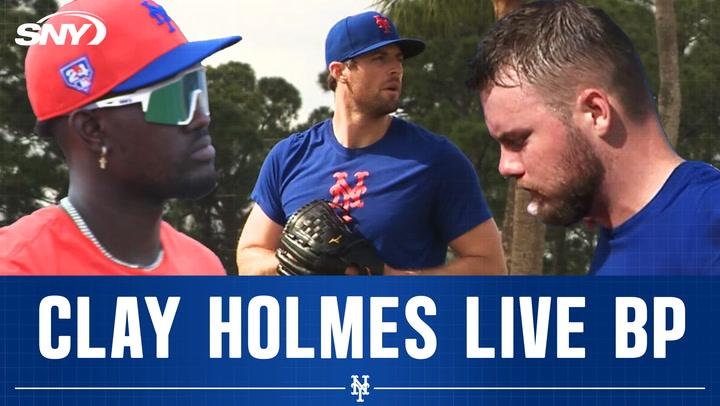 Clay Holmes pitches live batting practice at Mets camp; Ronny Mauricio on field in Port St. Lucie.