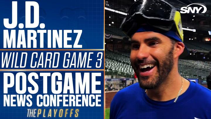 J.D. Martinez discusses intense Mets playoff atmosphere, calling regular season 'boring'.