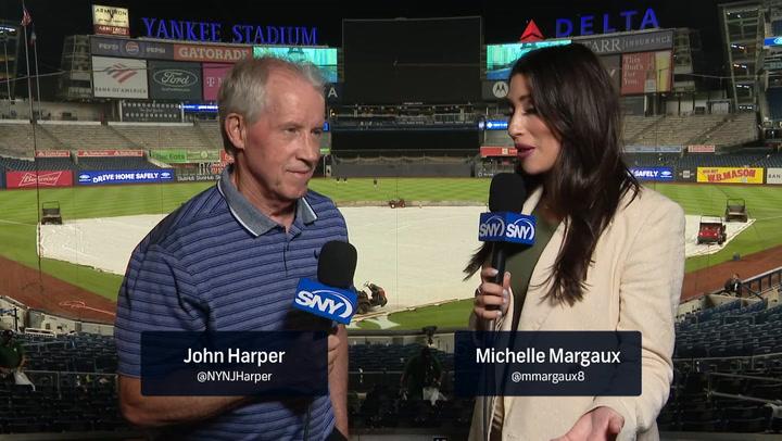 Two people discussing Mets win