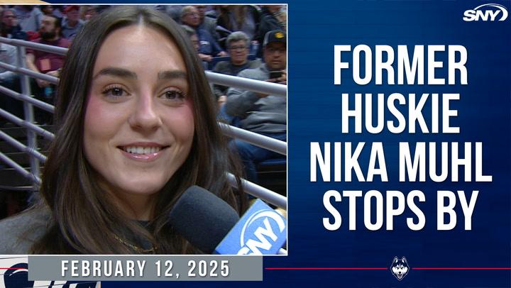 Former UConn guard Nika Muhl at a game, discussing her return: 'Like I never left.'