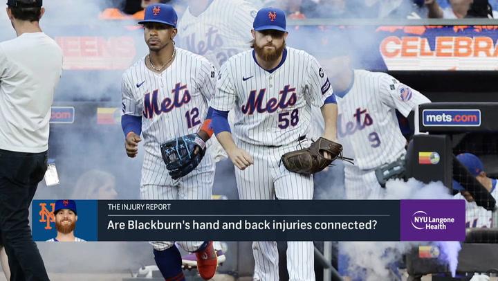 Two Mets players walk onto the field as text discusses Paul Blackburn's injury and NYU Langone.