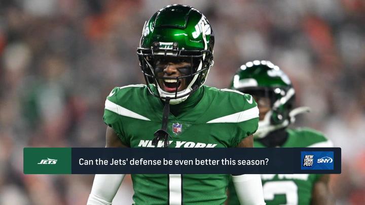 Jets player in green uniform on the field with overlay text: "Can the Jets' defense be even better this season?" NY Post's Brian Costello and Brandon London discuss 2024-25 expectations and Aaron Rodgers.