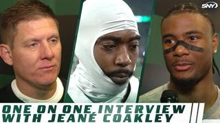 Jets players and staff featured in a one-on-one interview with Jeané Coakley, with SNY logo displayed.