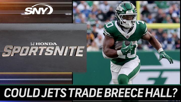 Image shows Breece Hall in a Jets uniform running with a football. Caption: Could Jets RB Hall be traded after an underwhelming 2024? | SportsNite.