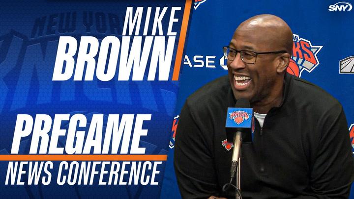Mike Brown smiles and speaks at a New York Knicks pregame news conference.