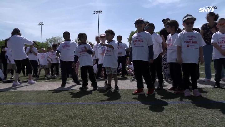 Children and volunteers engage in SNY's annual special needs field day in Bayonne, NJ.