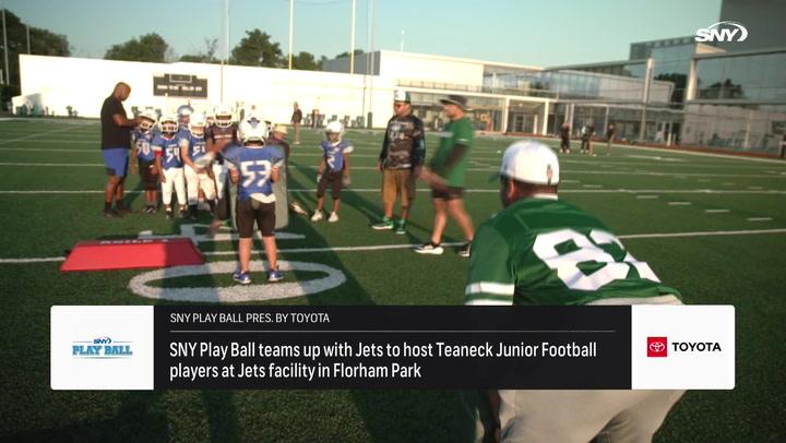 Youth football players practice on the field during the SNY Play Ball event with the New York Jets.