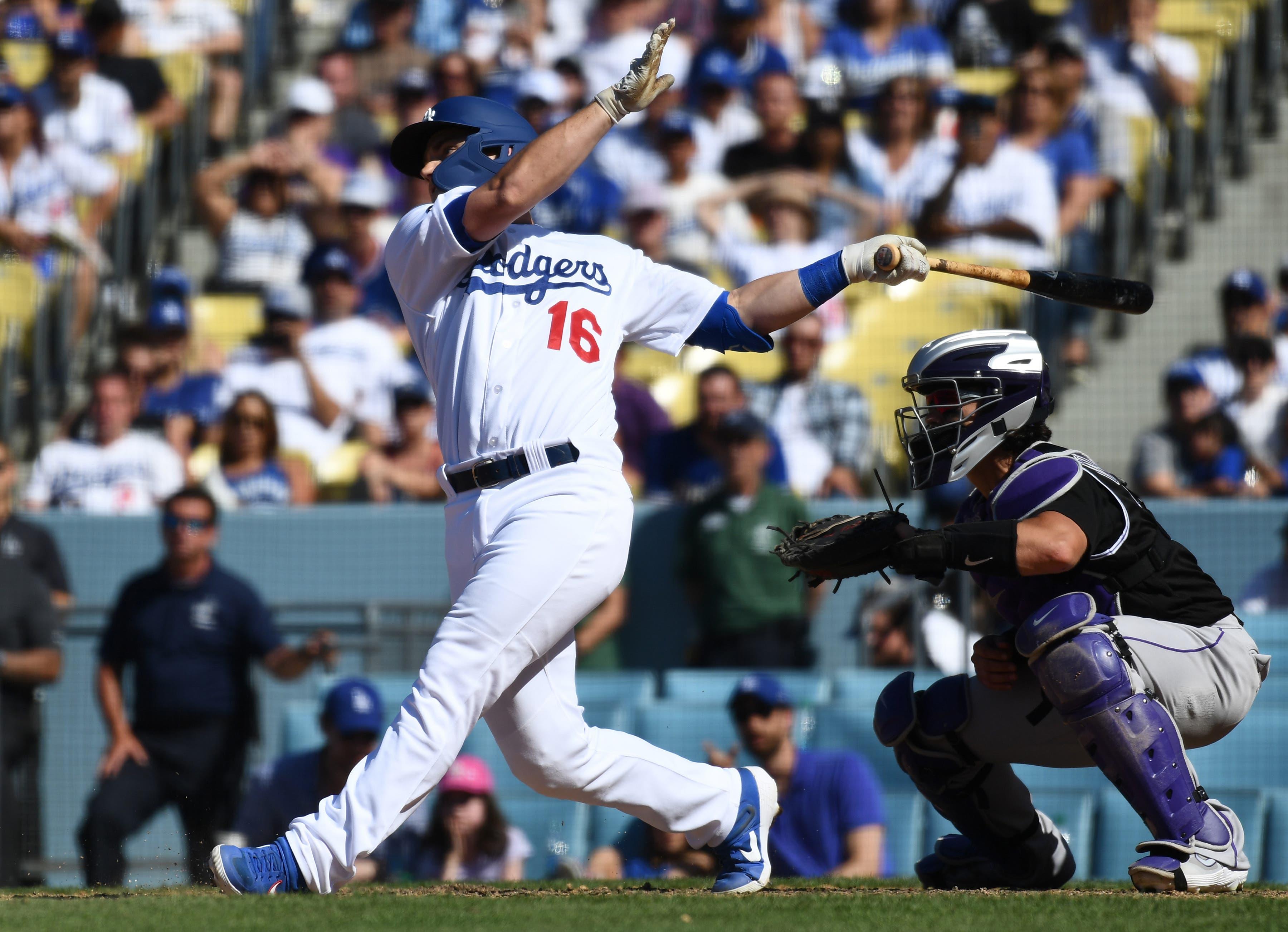 Jun 23, 2019; Los Angeles, CA, USA; Los Angeles Dodgers pitch hitter Will Smith (16) hits a three-run home run in the bottom of the ninth inning to beat the Colorado Rockies 6-3 at Dodger Stadium. Mandatory Credit: Robert Hanashiro-USA TODAY Sports / Robert Hanashiro