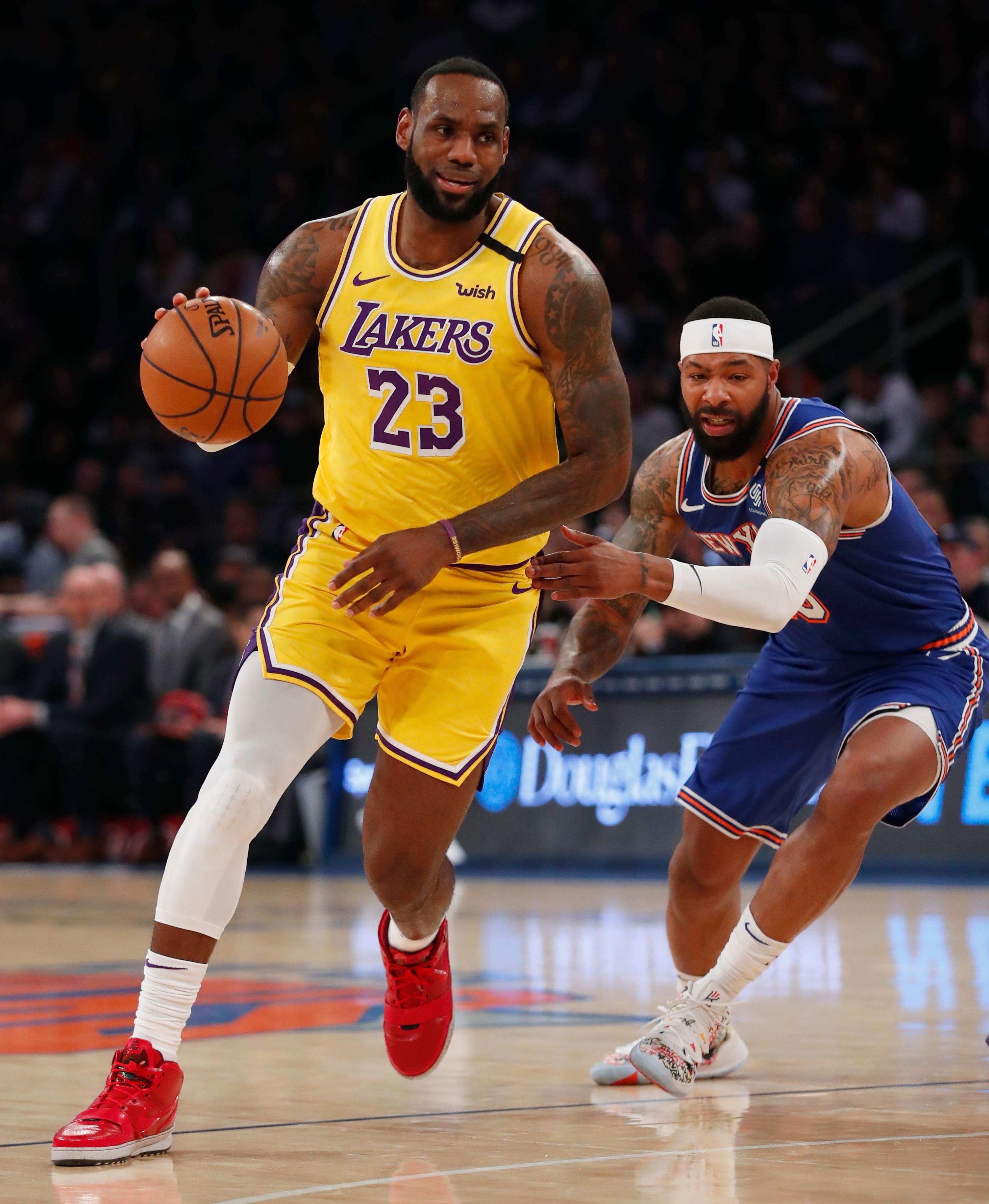 Jan 22, 2020; New York, New York, USA; Los Angeles Lakers forward LeBron James (23) drives to the basket against New York Knicks forward Marcus Morris Sr. (13) during the first half at Madison Square Garden. Mandatory Credit: Noah K. Murray-USA TODAY Sports