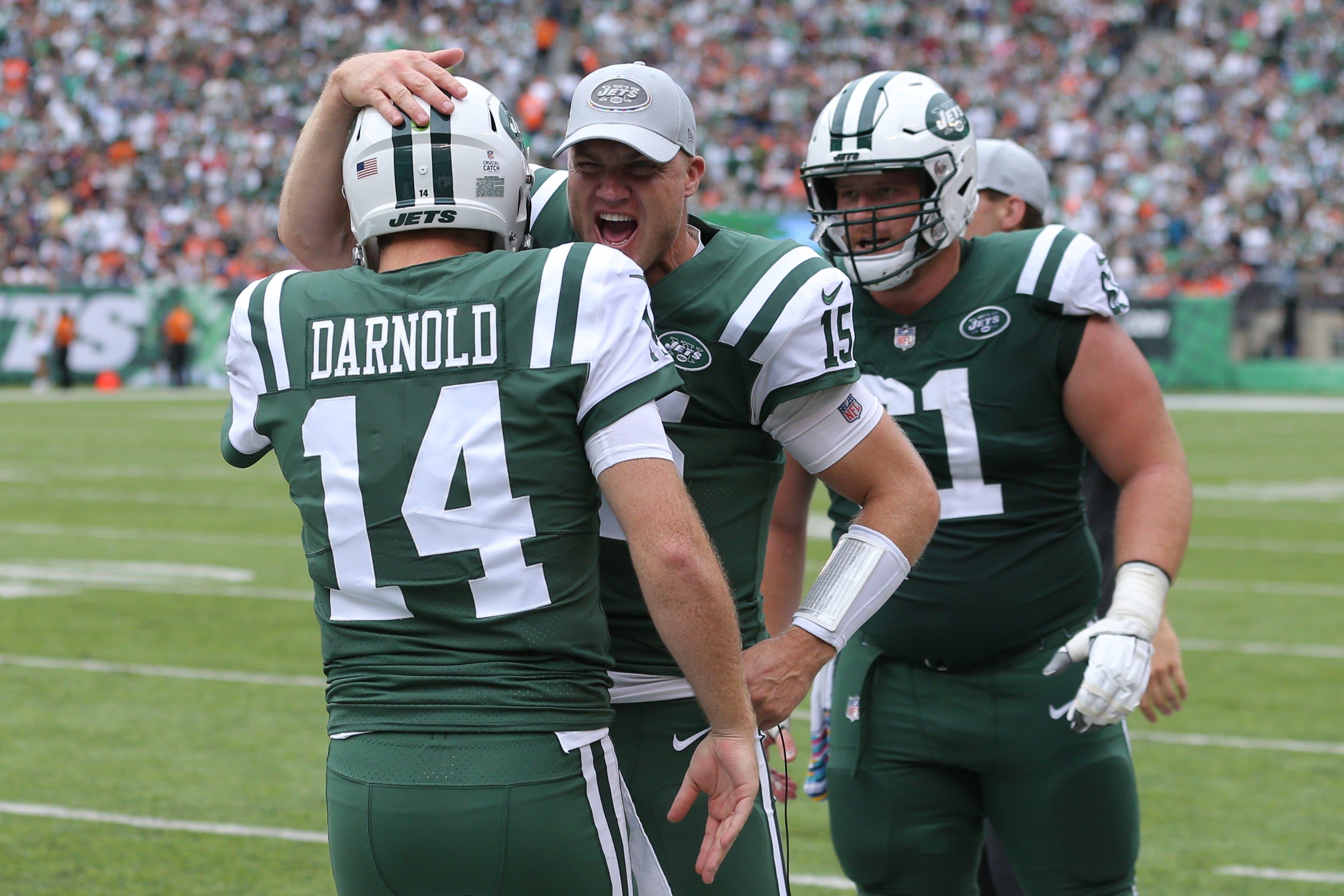 Oct 7, 2018; East Rutherford, NJ, USA; New York Jets quarterback Sam Darnold (14) celebrates a touchdown against the Denver Broncos with New York Jets quarterback Josh McCown (15) during the second quarter at MetLife Stadium. Mandatory Credit: Brad Penner-USA TODAY Sports / Brad Penner