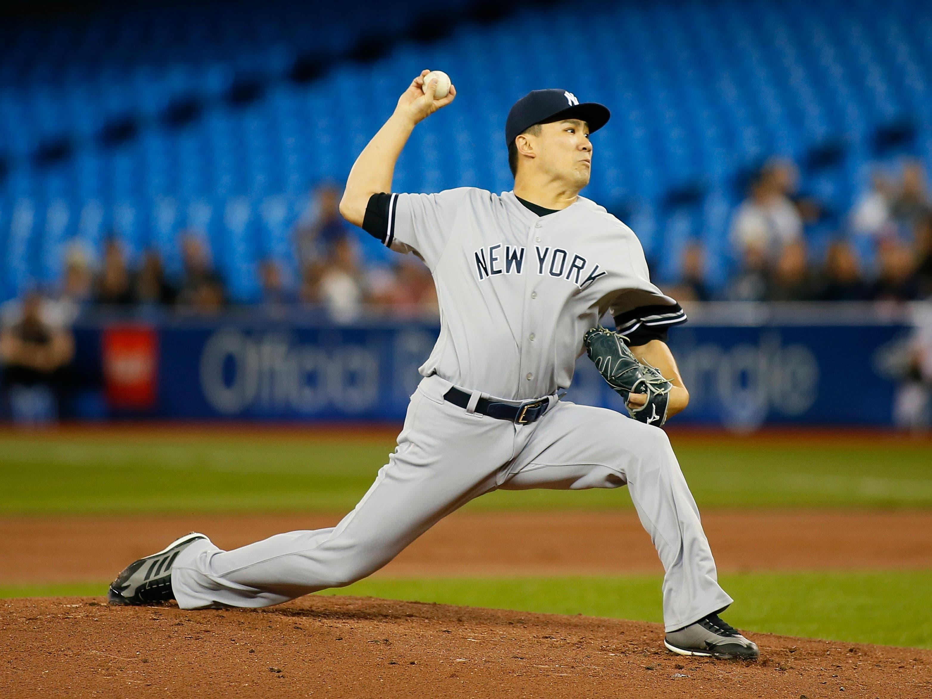 New York Yankees pitcher Masahiro Tanaka pitches to Toronto Blue Jays during the first inning at Rogers Centre. / John E. Sokolowski/USA TODAY Sports