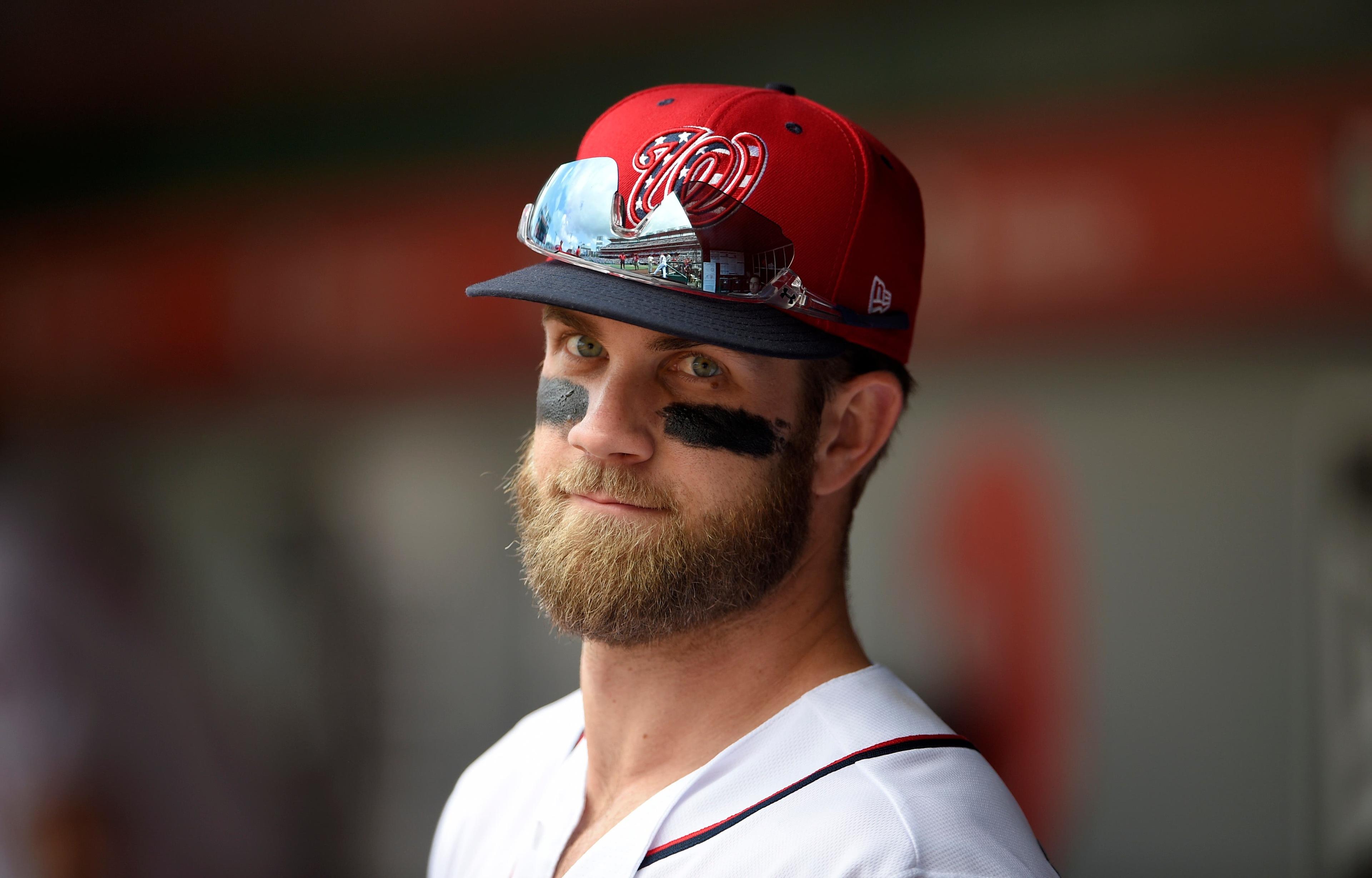 Washington Nationals' Bryce Harper looks out from the dugout before a baseball game against the Los Angeles Dodgers, Sunday, May 20, 2018, in Washington. (AP Photo/Nick Wass) / Nick Wass/AP