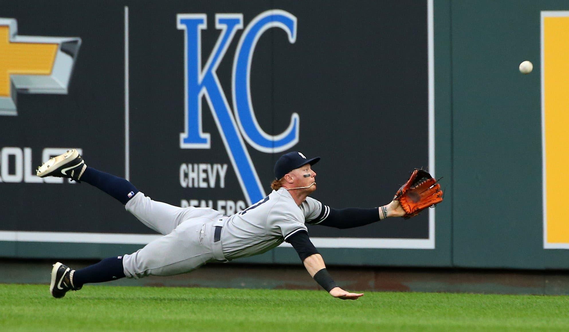 May 25, 2019; Kansas City, MO, USA; New York Yankees right fielder Clint Frazier (77) dives for the ball against the Kansas City Royals during the first inning in the second game of a double header at Kauffman Stadium. Mandatory Credit: Jay Biggerstaff-USA TODAY Sports / Jay Biggerstaff