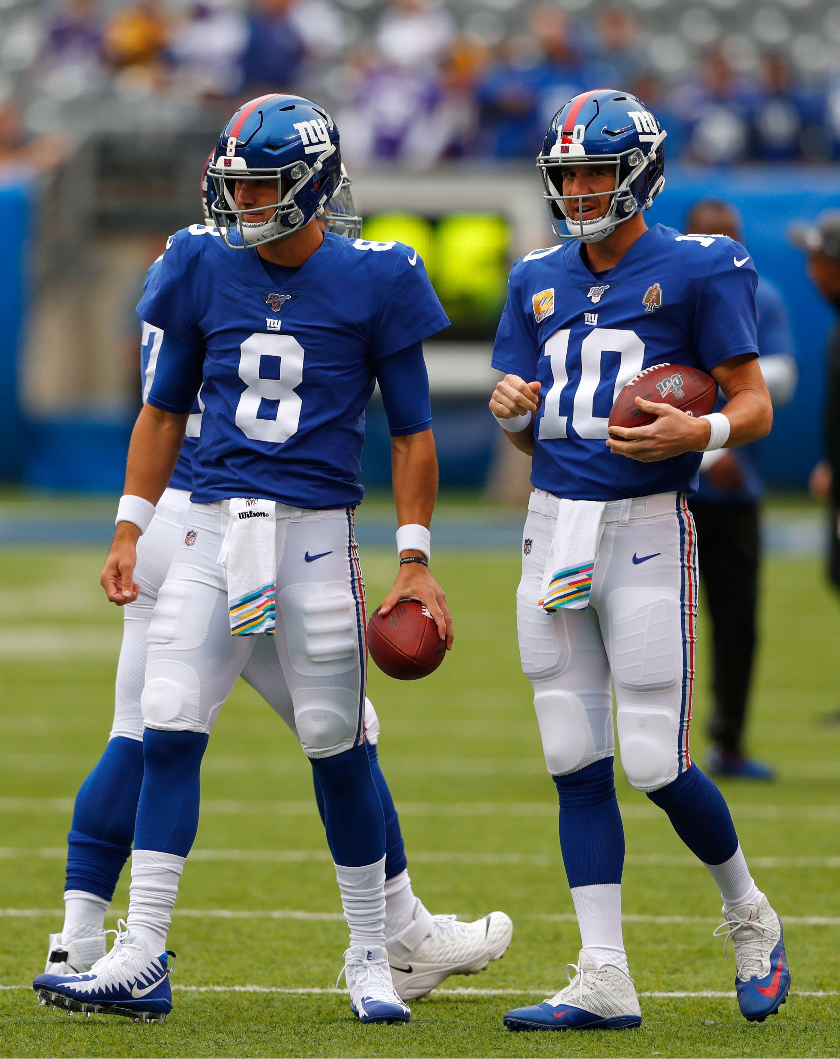 Oct 6, 2019; East Rutherford, NJ, USA; New York Giants quarterback Daniel Jones (8) and quarterback Eli Manning (10) during warm up before game against the Minnesota Vikings at MetLife Stadium. Mandatory Credit: Noah K. Murray-USA TODAY Sports / Noah K. Murray