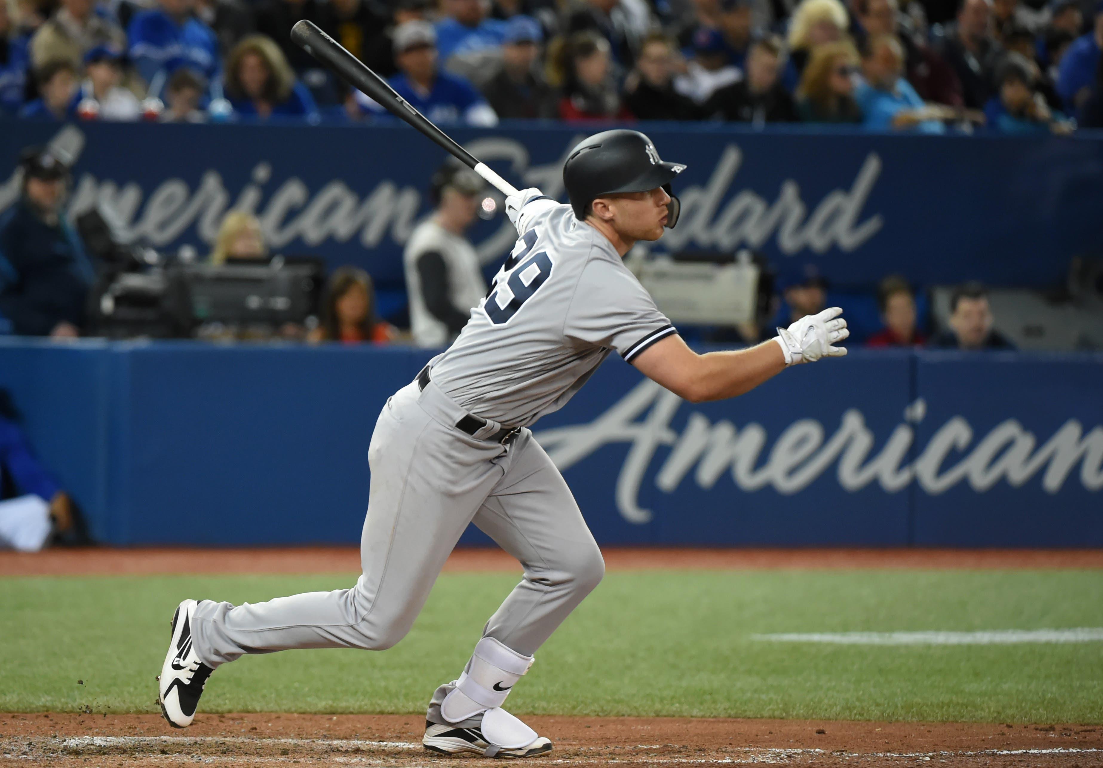 New York Yankees third baseman Brandon Drury hits a single against the Toronto Blue Jays in the sixth inning at Rogers Centre. / Dan Hamilton/USA TODAY Sports