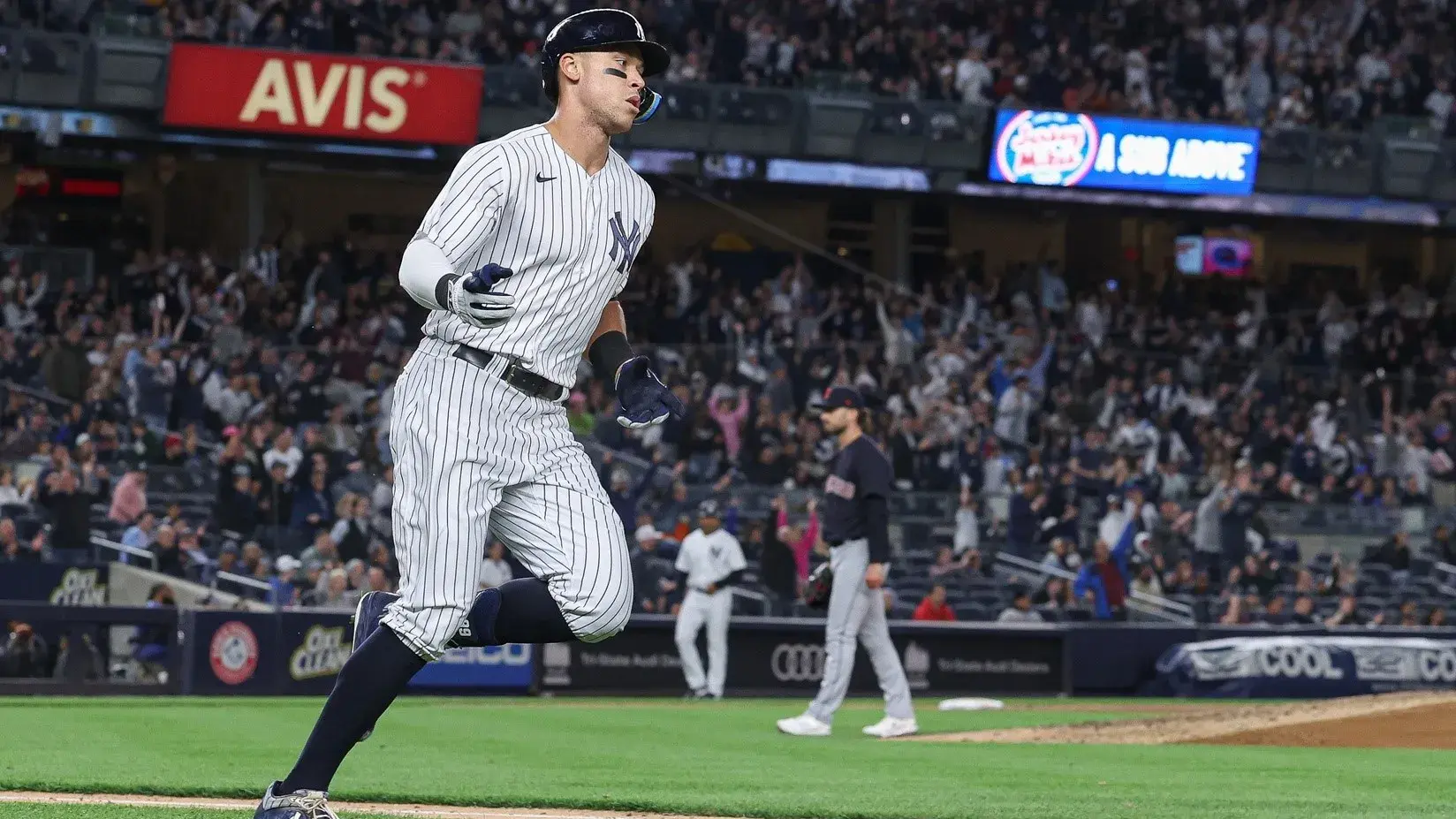 Apr 22, 2022; Bronx, New York, USA; New York Yankees right fielder Aaron Judge (99) rounds the bases after hitting a solo home run during the fifth inning off of Cleveland Guardians relief pitcher Tanner Tully (56) at Yankee Stadium. / Vincent Carchietta-USA TODAY Sports