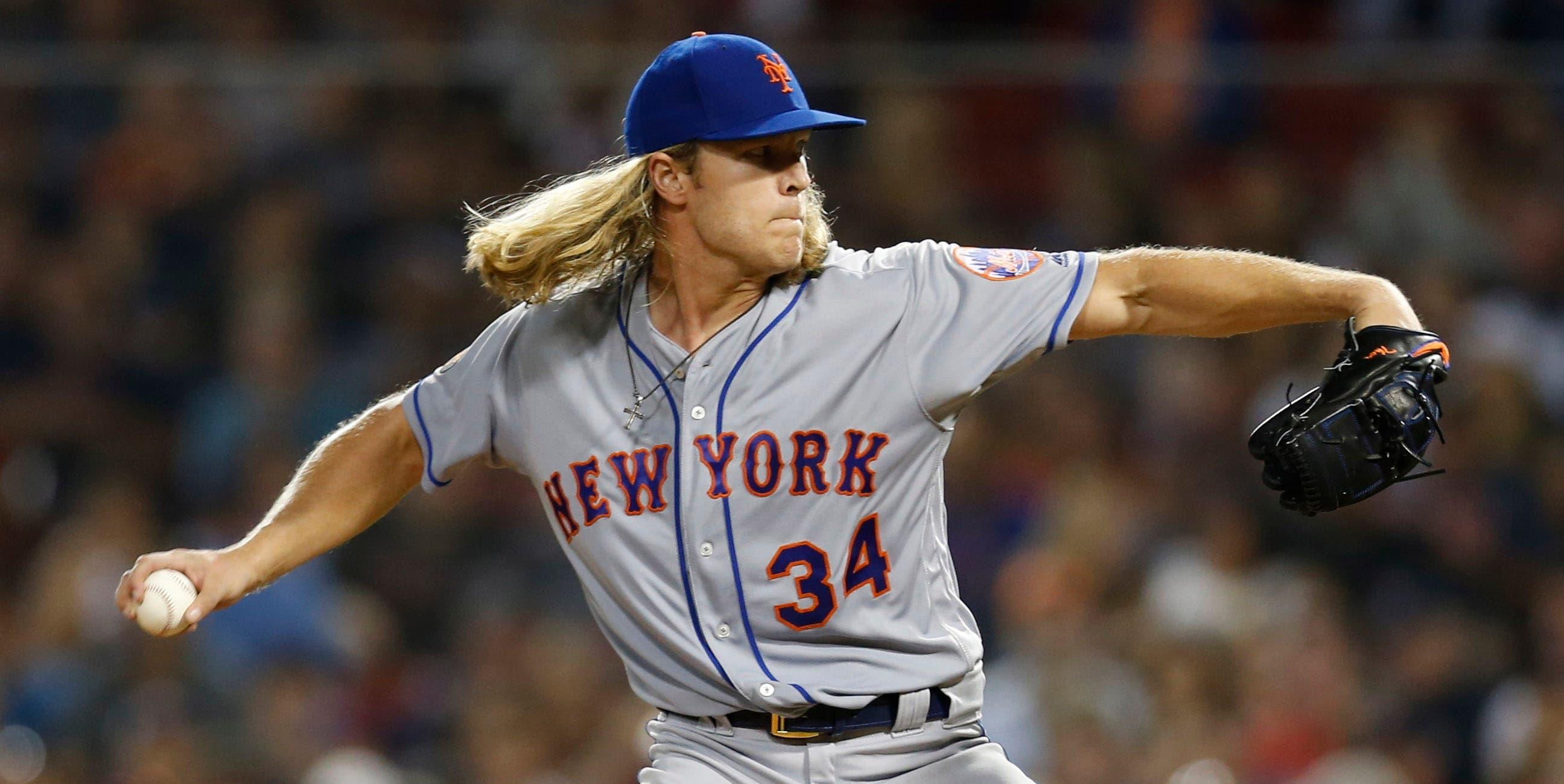 New York Mets Noah Syndergaard delivers a pitch during the third inning against the Boston Red Sox at Fenway Park. / Greg M. Cooper/USA TODAY Sports