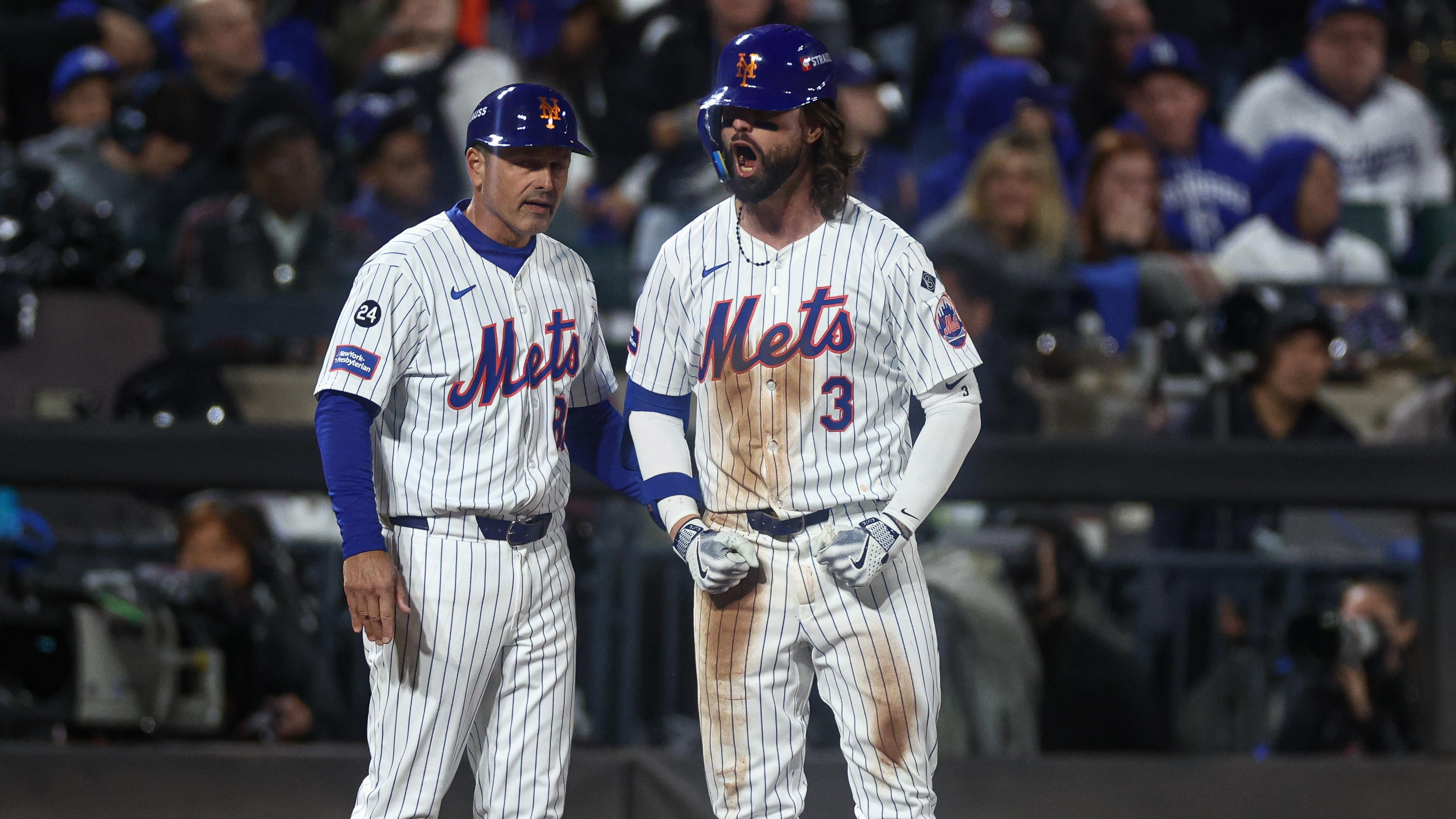 New York Mets left fielder Jesse Winker (3) reacts after hitting an RBI triple during the fourth inning against the Los Angeles Dodgers during game five of the NLCS for the 2024 MLB playoffs at Citi Field