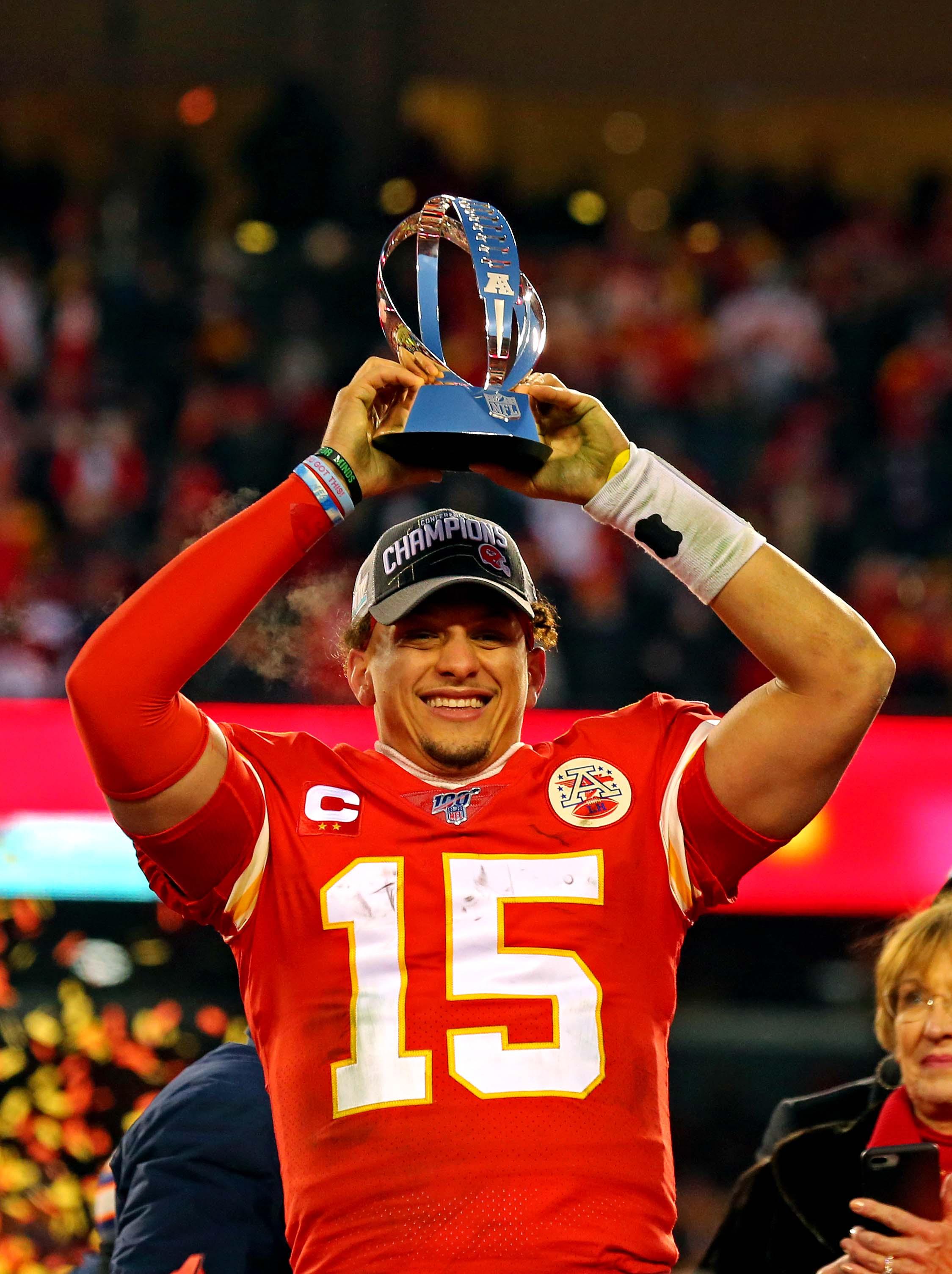 Jan 19, 2020; Kansas City, Missouri, USA; Kansas City Chiefs quarterback Patrick Mahomes (15) celebrates with the Lamar Hunt Trophy after beating the Tennessee Titans in the AFC Championship Game at Arrowhead Stadium. Mandatory Credit: Jay Biggerstaff-USA TODAY Sports / Jay Biggerstaff