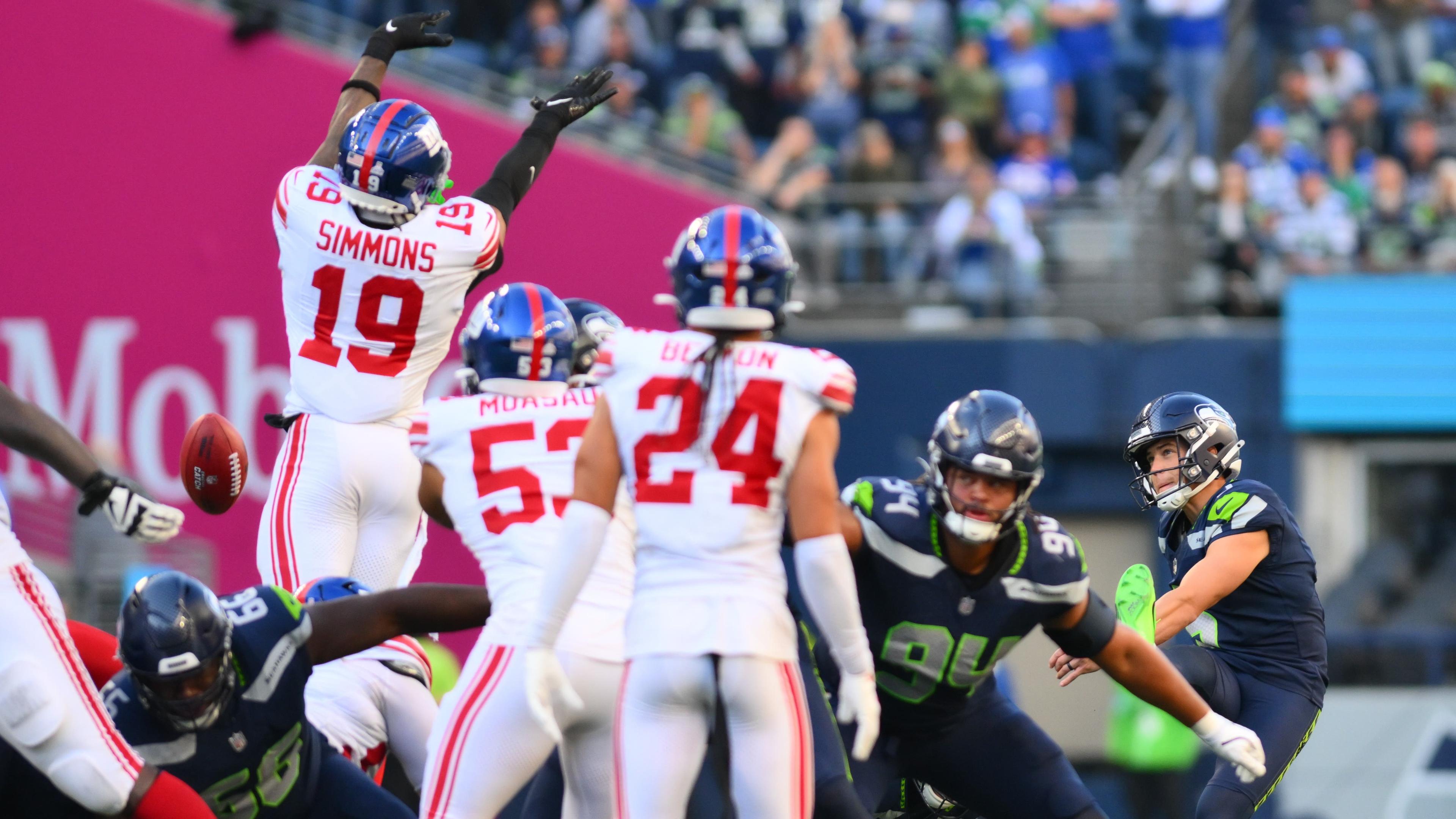 New York Giants linebacker Isaiah Simmons (19) blocks a field goal kick attempt by Seattle Seahawks place kicker Jason Myers (5) during the second half at Lumen Field