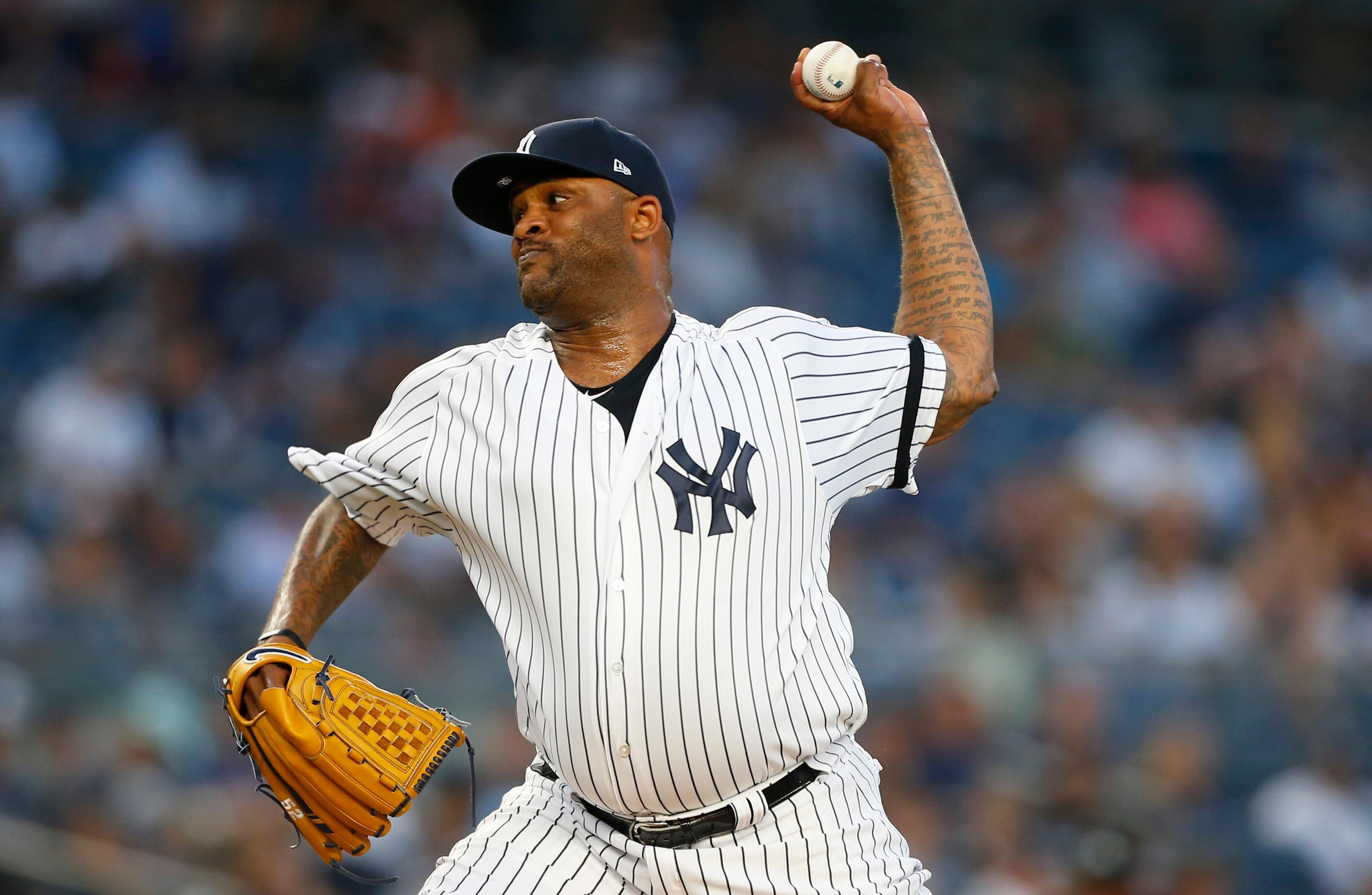 Aug 30, 2019; Bronx, NY, USA; New York Yankees starting pitcher CC Sabathia (52) pitches against the Oakland Athletics in the first inning at Yankee Stadium. Mandatory Credit: Noah K. Murray-USA TODAY Sports