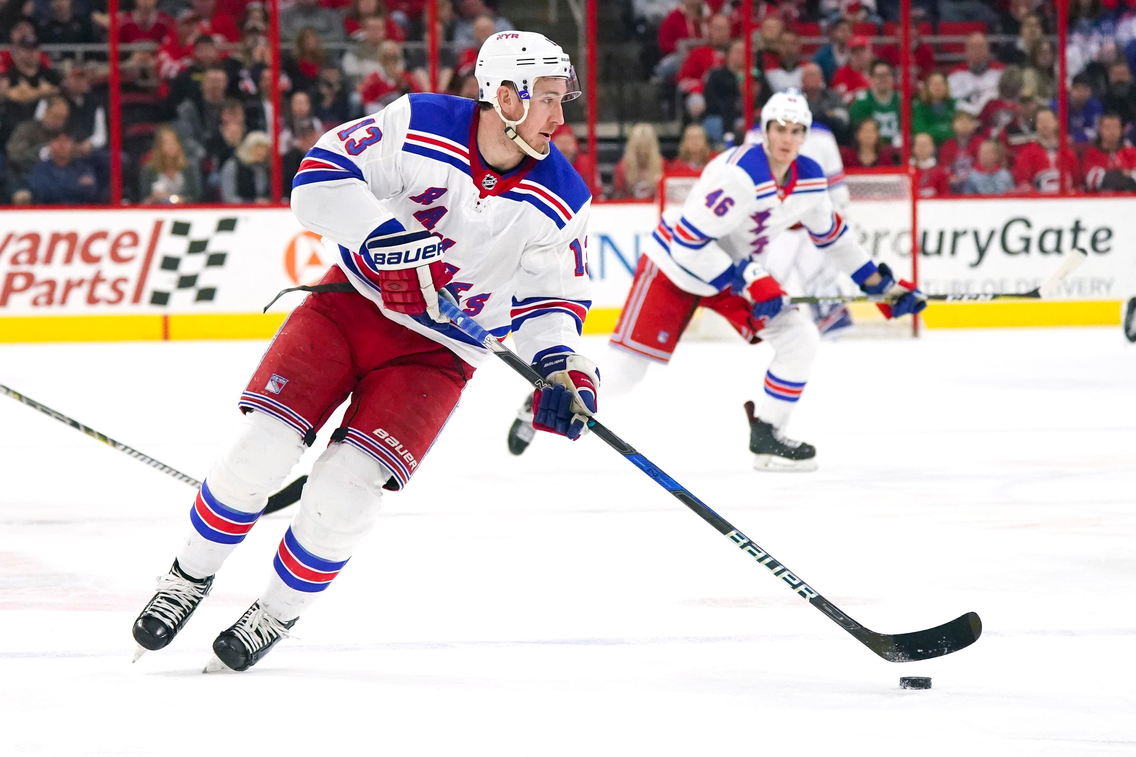 Mar 31, 2018; Raleigh, NC, USA; New York Rangers forward Kevin Hayes (13) skates with the puck against the Carolina Hurricanes at PNC Arena. The New York Rangers defeated the Carolina Hurricanes 2-1. Mandatory Credit: James Guillory-USA TODAY Sports / James Guillory