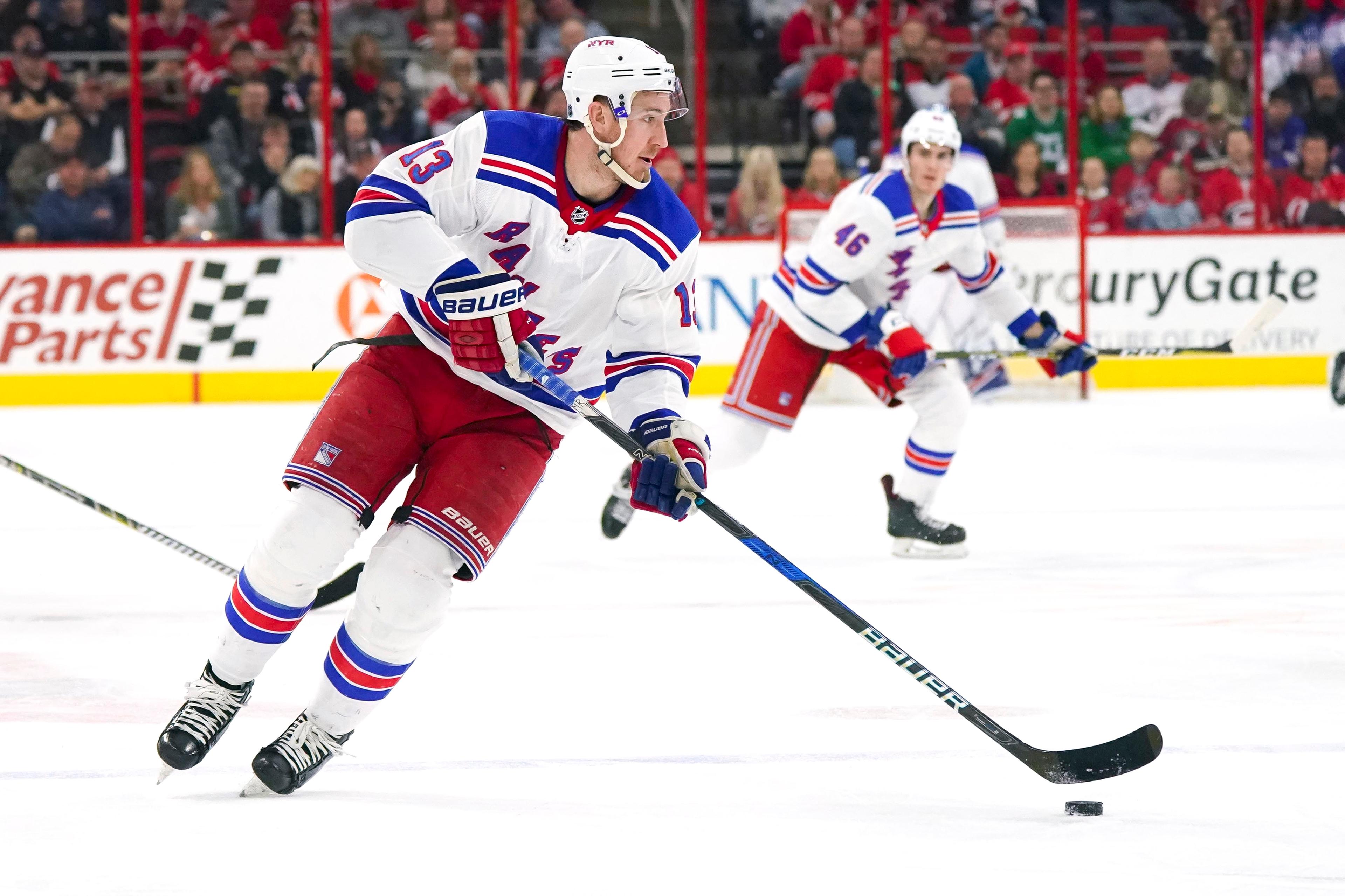 Mar 31, 2018; Raleigh, NC, USA; New York Rangers forward Kevin Hayes (13) skates with the puck against the Carolina Hurricanes at PNC Arena. The New York Rangers defeated the Carolina Hurricanes 2-1. Mandatory Credit: James Guillory-USA TODAY Sports