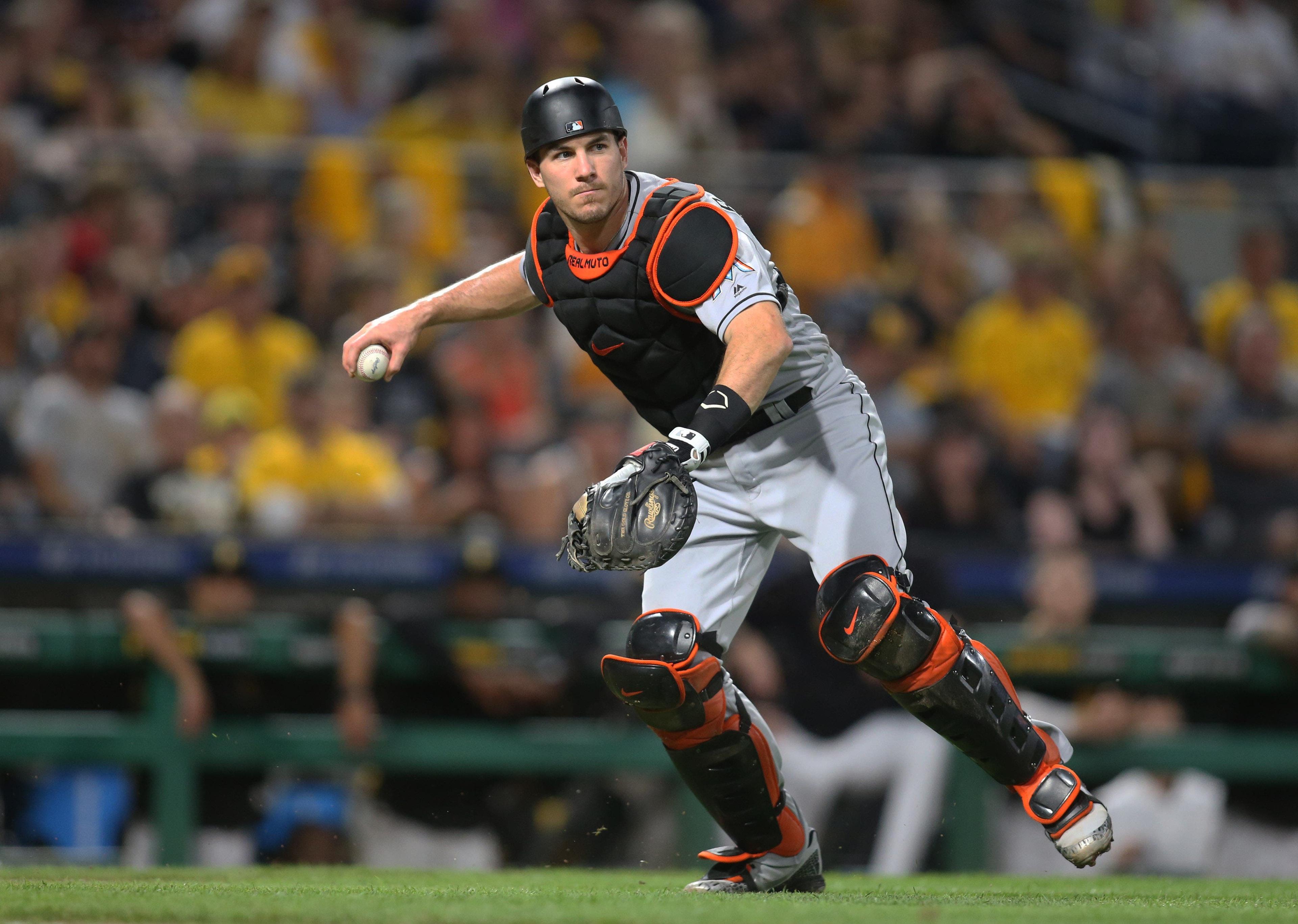 Sep 7, 2018; Pittsburgh, PA, USA; Miami Marlins catcher J.T. Realmuto (11) throws to first base to retire Pittsburgh Pirates starting pitcher Chris Archer (not pictured) during the third inning at PNC Park. Mandatory Credit: Charles LeClaire-USA TODAY Sports / Charles LeClaire