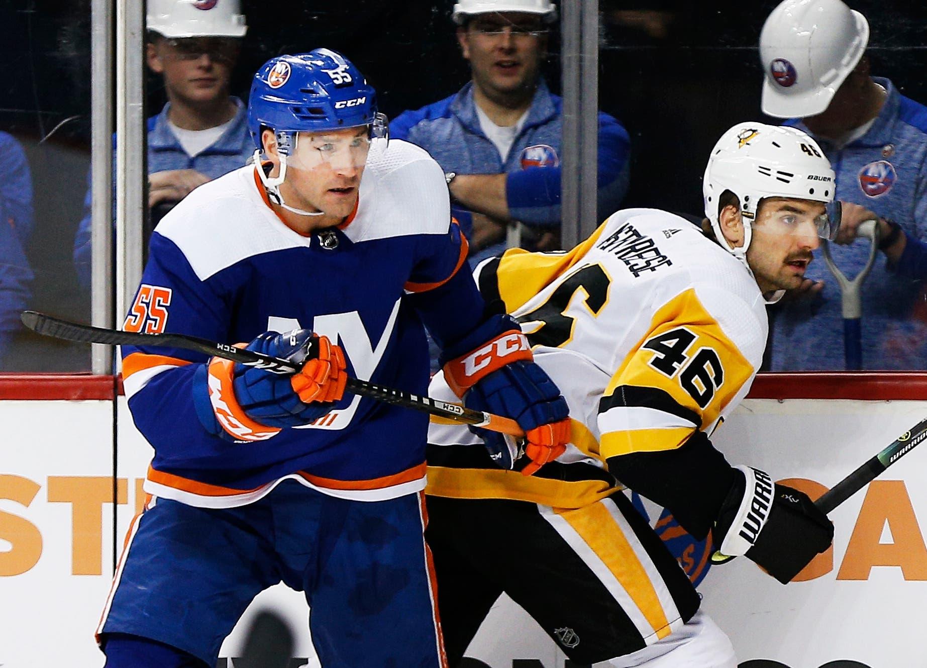 Nov 21, 2019; Brooklyn, NY, USA; New York Islanders defenseman Johnny Boychuk (55) and Pittsburgh Penguins center Zach Aston-Reese (46) battle along the boards during the first period at Barclays Center. Mandatory Credit: Andy Marlin-USA TODAY Sportsundefined