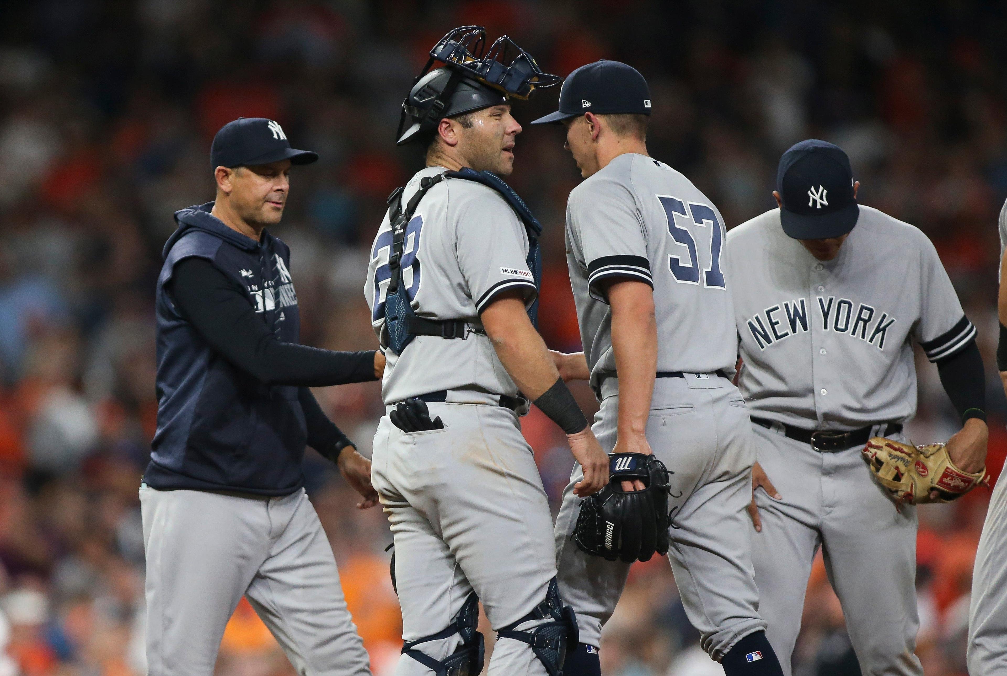 Apr 9, 2019; Houston, TX, USA; New York Yankees relief pitcher Chad Green (57) hands the ball to manager Aaron Boone (17) during a pitching change in the eighth inning against the Houston Astros at Minute Maid Park. Mandatory Credit: Troy Taormina-USA TODAY Sports / Troy Taormina