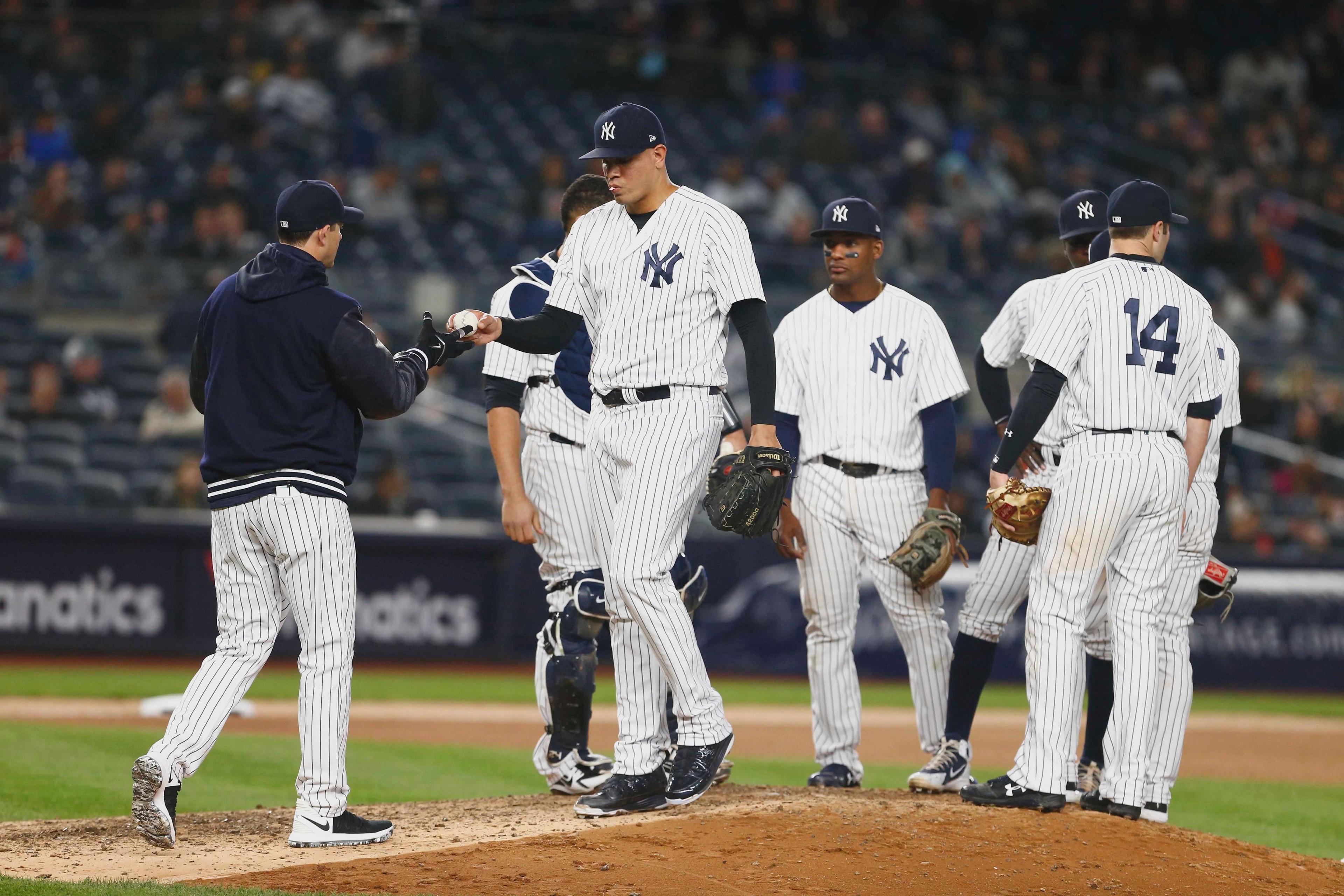 Apr 24, 2018; Bronx, NY, USA; New York Yankees manager Aaron Boone (17) takes the ball from New York Yankees relief pitcher Dellin Betances (68) in the seventh inning against the Minnesota Twins at Yankee Stadium. Mandatory Credit: Noah K. Murray-USA TODAY Sports / Noah K. Murray