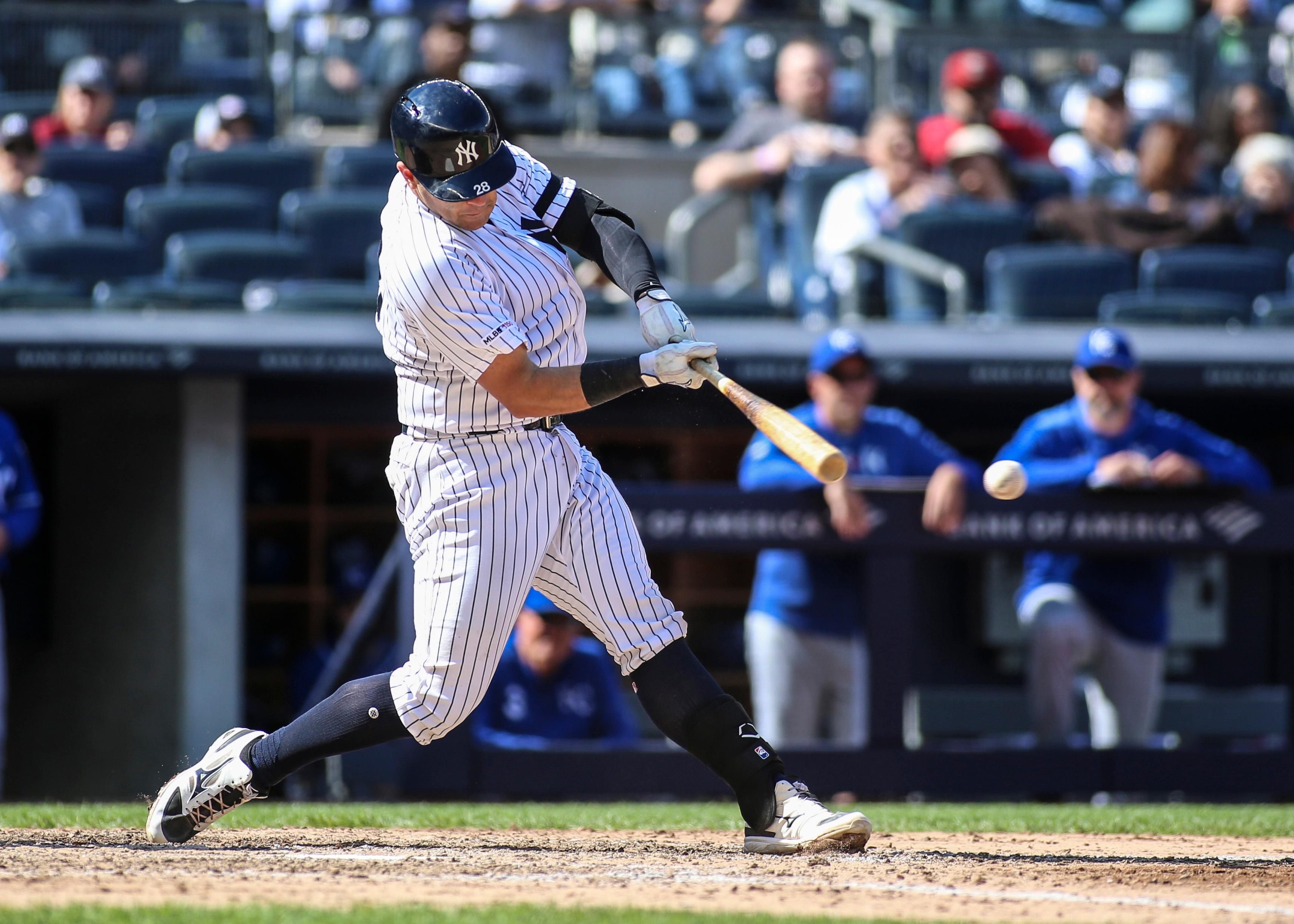 New York Yankees catcher Austin Romine hits an RBI single in the eighth inning against the Kansas City Royals at Yankee Stadium.