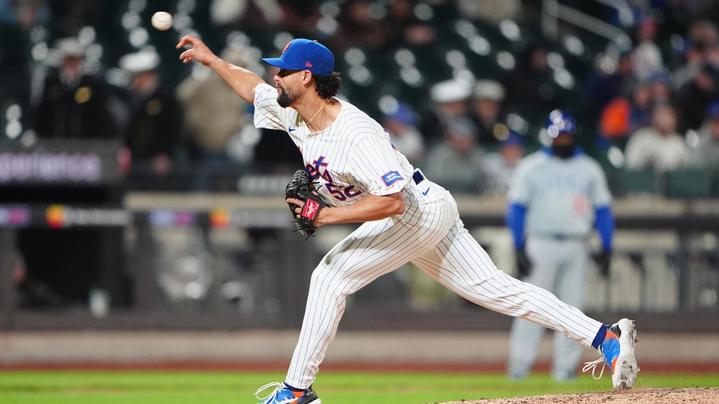 Apr 30, 2024; New York City, New York, USA; New York Mets pitcher Jorge Lopez (52) delivers a pitch against the Chicago Cubs during the ninth inning at Citi Field.
