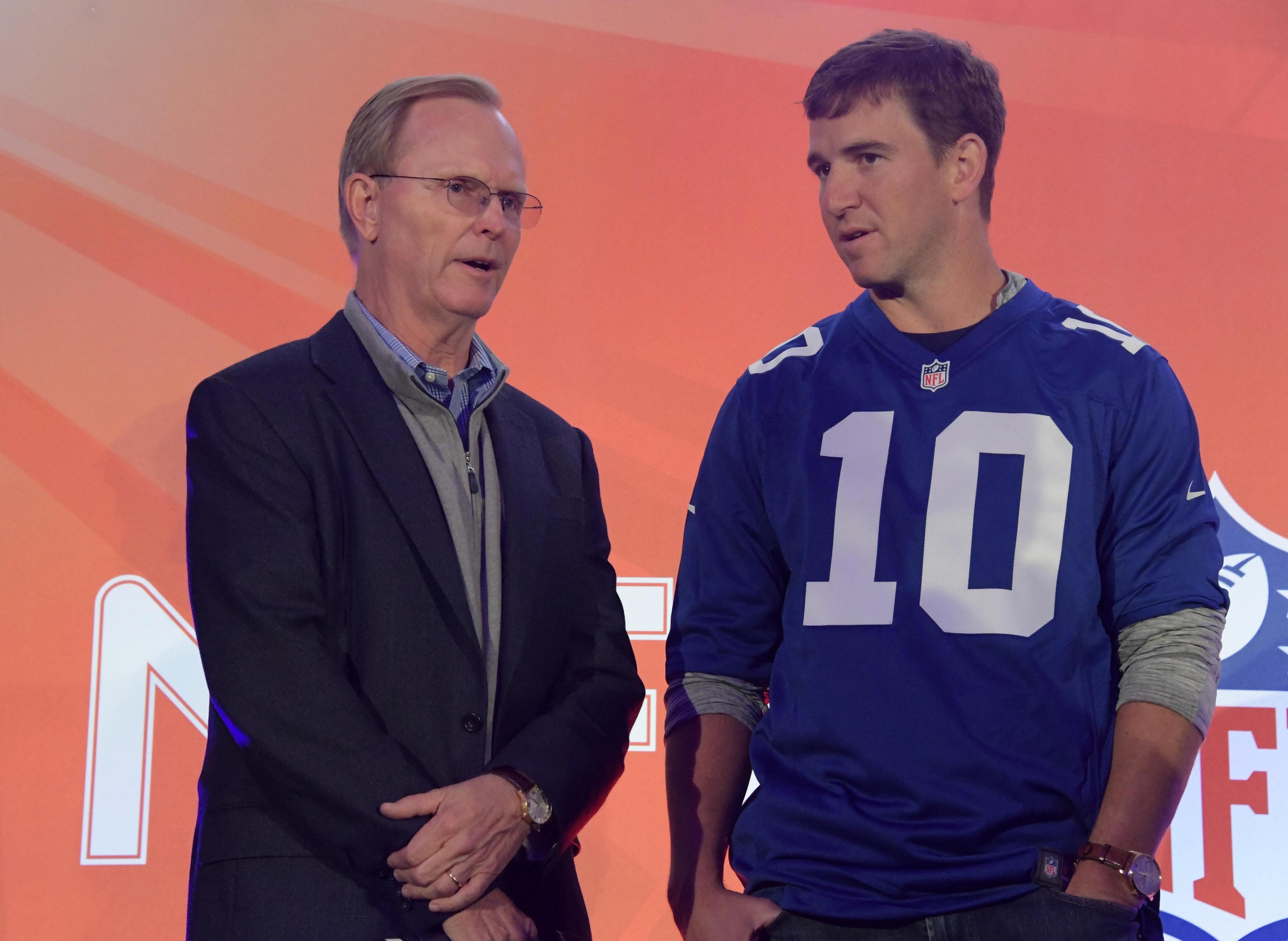 Oct 22, 2016; London, United Kingdom; New York Giants co-owner John Mara (left) and quarterback Eli Manning during NFL Fan Rally at the Victoria House prior to game 16 of the NFL International Series against the Los Angeles Rams. Mandatory Credit: Kirby Lee-USA TODAY Sports / Kirby Lee