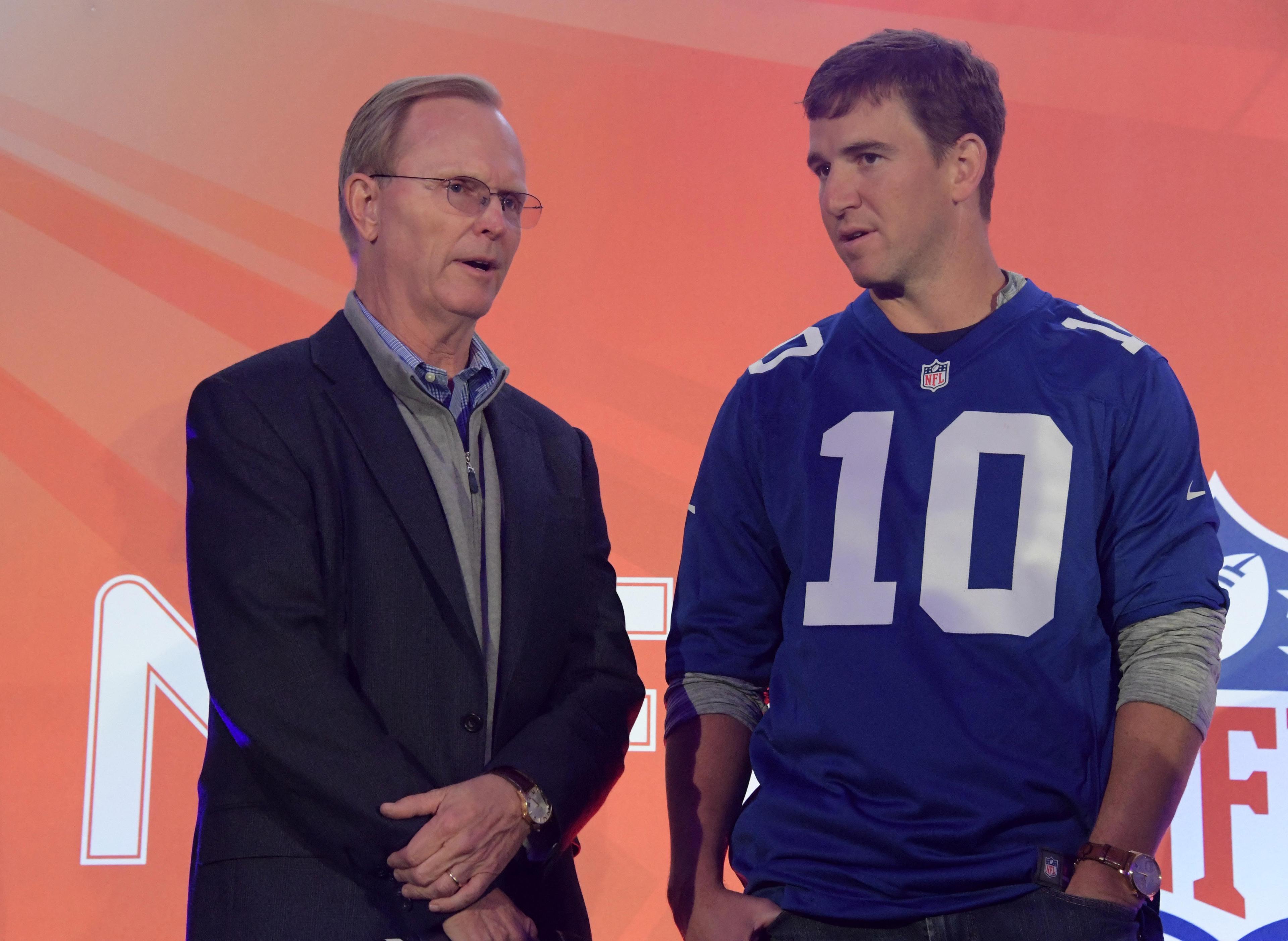 Oct 22, 2016; London, United Kingdom; New York Giants co-owner John Mara (left) and quarterback Eli Manning during NFL Fan Rally at the Victoria House prior to game 16 of the NFL International Series against the Los Angeles Rams. Mandatory Credit: Kirby Lee-USA TODAY Sports