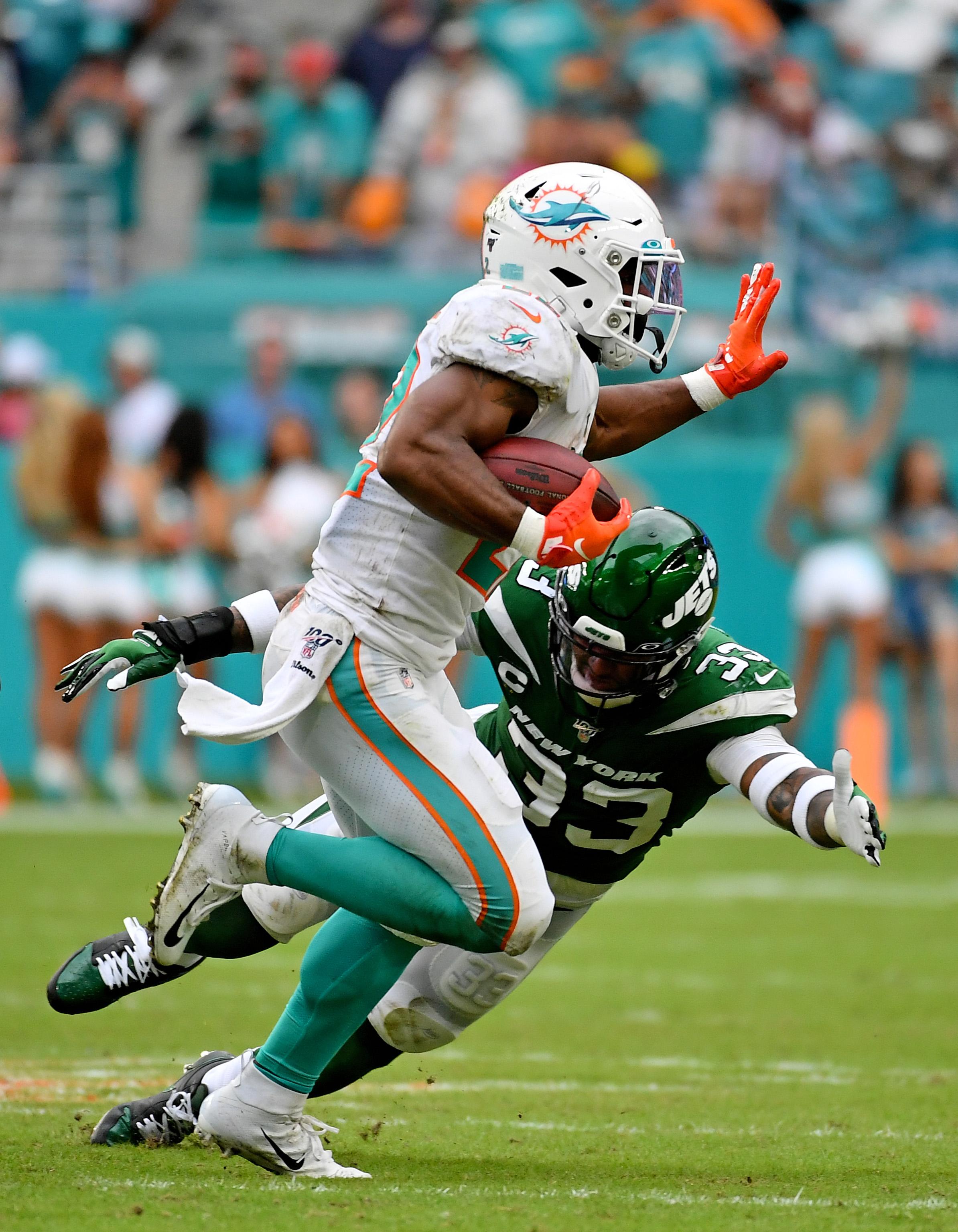 Nov 3, 2019; Miami Gardens, FL, USA; New York Jets strong safety Jamal Adams (33) attempts to bring down Miami Dolphins running back Mark Walton (22) during the second half at Hard Rock Stadium. Mandatory Credit: Jasen Vinlove-USA TODAY Sports